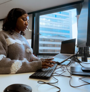 Oyinlola Akindele at her desk, working